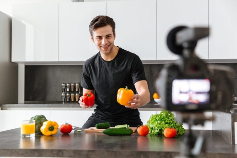 cheerful-young-man-filming-his-video-blog-scaled